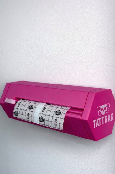 Vault wrap dispenser from TattRak, in Tia Berry's tattoo station