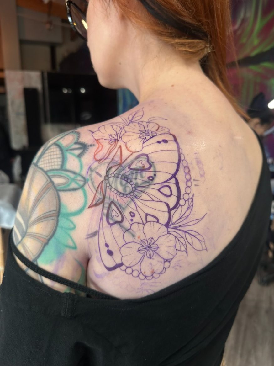 Shoulder tattoo before Tia Berry's coverup