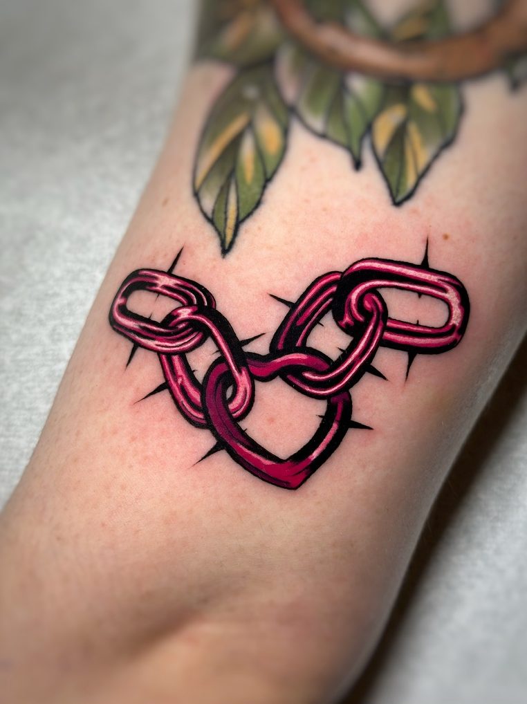 Heart chain tattoo on the arm by Tia Berry, colour tattoo artist in Vancouver